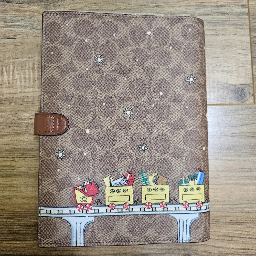 NWOT Coach Signature Canvas Notebook with Holiday Train